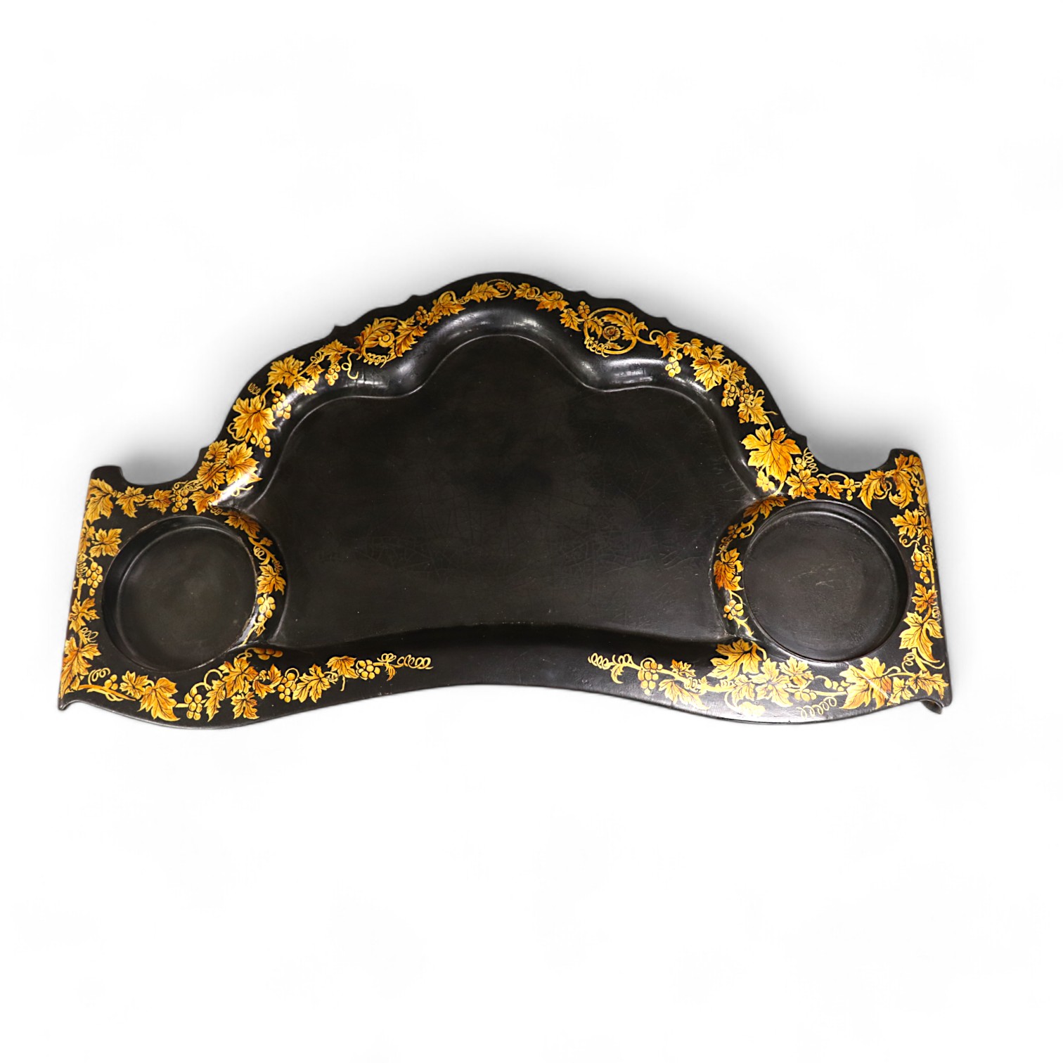 An unusual black lacquered sectional tray, with guilt decoration of fruiting grape vines, 72cm wide. Condition - fair to good, some crazing to surface.